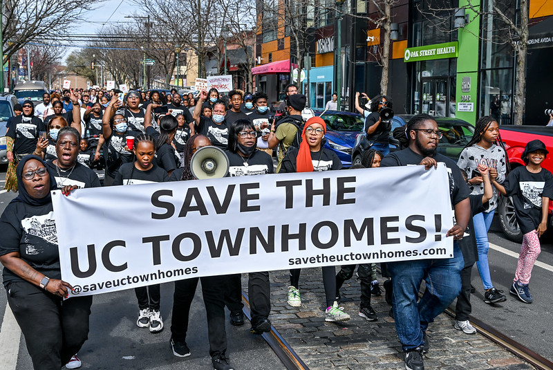 Save the Uc Townhomes -- march with banner